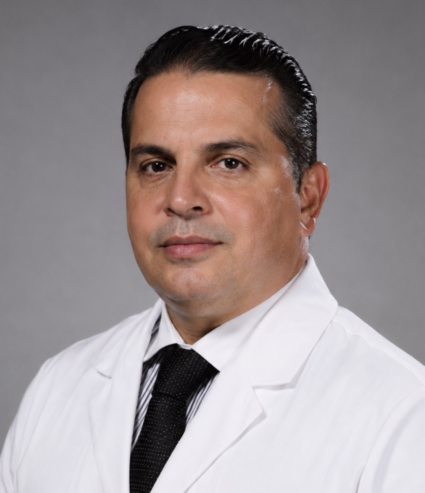 Portrait of Dr. David Bencomo in a white coat